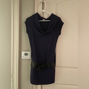 Short sleeve dark purple dress. Very short with a black belt around the waist